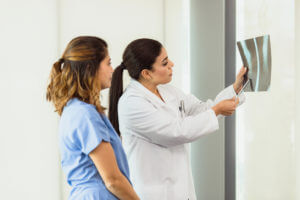 Doctor pointing at xrays
