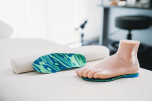 Footprints with mannequin feet - Podiatry concept. Podiatrist medical clinic.