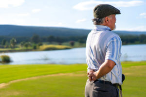A senior golfer experienced back pain while golfing at the country club.
